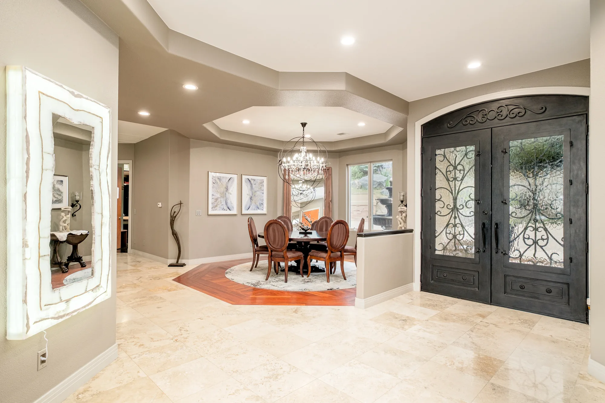 View from the foyer through to the dining area, wood floors and long sightlines.